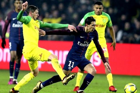 PSG's Angel Di Maria, right, challenges for the ball with Nantes' forward Emiliano Sala during their French League One soccer match, in Nantes, western France, Sunday, Jan. 14, 2018. (AP Photo/David Vincent)