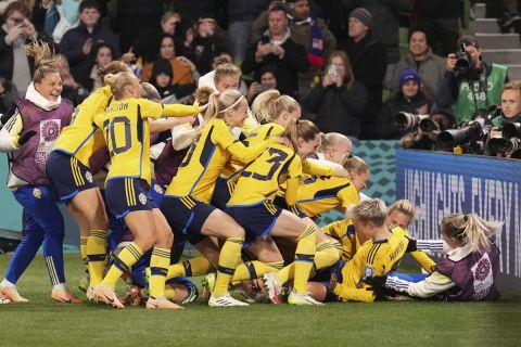 Sweden celebrate after defeating the United States in a penalty shootout in their Women's World Cup round of 16 soccer match in Melbourne, Australia, Sunday, Aug. 6, 2023. (AP Photo/Scott Barbour)