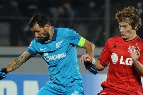Tin Jedvaj of Bayer Leverkusen (R) fights for a ball with Danny of Zenit St.Petersburg during UEFA Champions League group C soccer match Zenit vs Leverkusen in St.Petersburg, on November 4, 2014. AFP PHOTO / OLGA MALTSEVA        (Photo credit should read OLGA MALTSEVA/AFP/Getty Images)