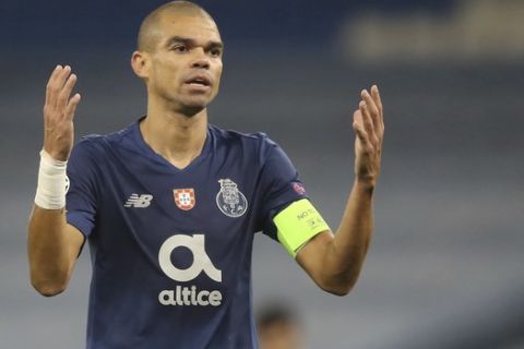 Porto's Pepe gestures during the Champions League group C soccer match between Manchester City and FC Porto at the Etihad stadium in Manchester, England, Wednesday, Oct. 21, 2020. (Martin Rickett/Pool via AP)
