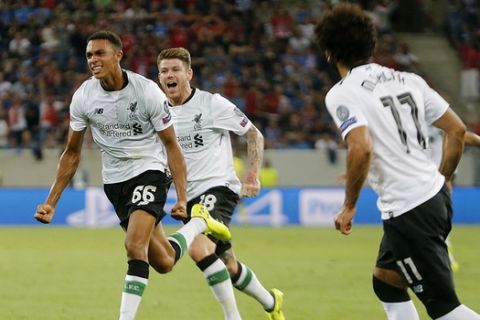 Liverpool's Trent Alexander-Arnold, left, celebrates his side's opening goal with a free kick during a Champions League's qualifier first leg soccer match between 1899 Hoffenheim and FC Liverpool, in the Rhein-Neckar-Arena, in Sinsheim, Germany, Tuesday, Aug. 15, 2017. (AP Photo/Michael Probst)