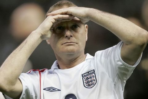 England's Paul Gascoigne looks into the stands after victory against the Rest of the World in the Soccer Aid Charity soccer match at Manchester United's Old Trafford Stadium in Manchester, England, Saturday May 27, 2006. The charity match saw celebrities and ex-professional footballers playing against each other to raise funds for UNICEF. (AP Photo/Dave Thompson)