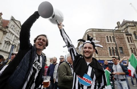 Juventus fans cheer ahead of the Champions League final soccer match between Juventus and Real Madrid at the Millennium Stadium in Cardiff, Wales, Saturday June 3, 2017. (AP Photo/Kirsty Wigglesworth)