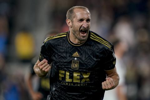 Los Angeles FC defender Giorgio Chiellini reacts after a goal by midfielder Ryan Hollingshead against the Vancouver Whitecaps during the second half of an MLS playoff soccer match Saturday, Oct. 28, 2023, in Los Angeles. (AP Photo/Ryan Sun)