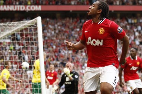 Manchester United's Anderson celebrates scoring against Norwich City during their English Premier League soccer match at Old Trafford Stadium, Manchester, England, Saturday Oct. 1, 2011. (AP Photo/Jon Super)