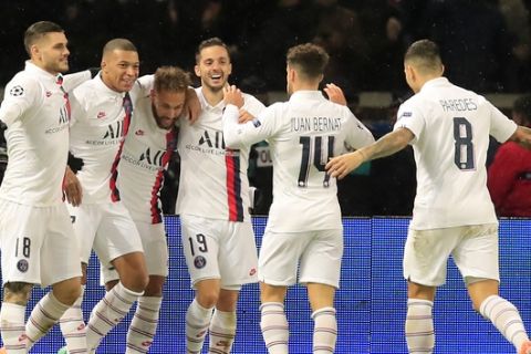 PSG's Neymar, third from left, celebrates with his teammates Mauro Icardi, left Kylian Mbappe, Pablo Sarabia, Juan Bernat, and Leandro Paredes, after scoring his side's third goal during the Champions League, group A soccer match between PSG and Galatasaray, at the Parc des Princes stadium in Paris, Wednesday, Dec. 11, 2019. (AP Photo/Michel Euler)