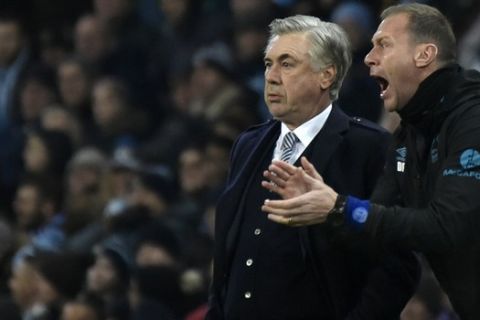 Everton's manager Carlo Ancelotti, left, and assistant manager Duncan Ferguson react during the English Premier League soccer match between Manchester City and Everton at Etihad stadium in Manchester, England, Wednesday, Jan. 1, 2020. (AP Photo/Rui Vieira)