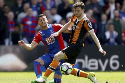Crystal Palace's Joel Ward , left and Hull City's Andrew Robertson battle for the ball, during the English Premier League soccer match between Crystal Palace and Hull City, at Selhurst Park, London, Sunday May 14, 2017.  (Paul Harding/PA via AP)