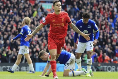Liverpool's Philippe Coutinho celebrates scoring his side's second goal, during the English Premier League soccer match between Liverpool and Everton, at Anfield, in Liverpool, England, Saturday April 1, 2017. (Peter Byrne/PA via AP)