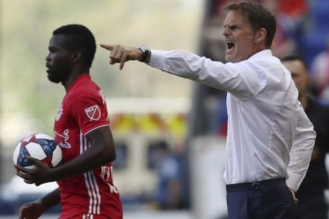 Atlanta United head coach Frank de Boer, right, yells instructions to his team during the first half of an MLS soccer match, Sunday, May 19, 2019, in Harrison, N.J. The New York Red Bulls won 1-0. (AP Photo/Steve Luciano)