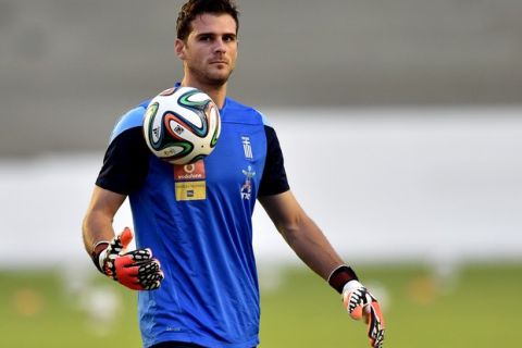 Greece's goalkeeper Orestis Karnezis takes part in a training session in Aracaju, Brazil on June 26, 2014, ahead the 2014 FIFA World Cup match against Costa Rica . AFP PHOTO / ARIS MESSINIS        (Photo credit should read ARIS MESSINIS/AFP/Getty Images)