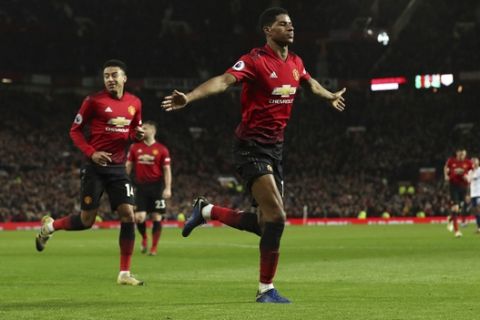 Manchester United's Marcus Rashford celebrates scoring his side's third goal of the game during the English Premier League soccer match between Manchester United and AFC Bournemouth at Old Trafford, Manchester, England, Sunday, Dec. 30, 2018. (Martin Rickett/PA via AP)