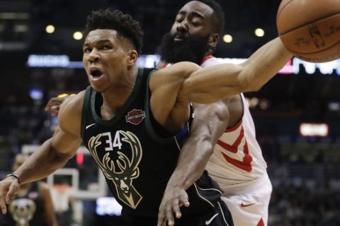 Milwaukee Bucks' Giannis Antetokounmpo is fouled by Houston Rockets' James Harden during the second half of an NBA basketball game Wednesday, March 7, 2018, in Milwaukee. (AP Photo/Morry Gash)