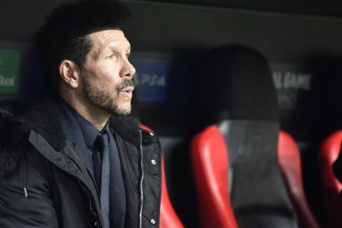 Atletico Madrid coach Diego Simeone waits for the start of the Champions League, Group D, soccer match between Leverkusen and Atletico Madrid at the BayArena in Leverkusen, Germany, Wednesday, Nov. 6, 2019. (AP Photo/Martin Meissner)