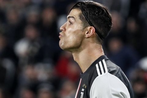 Juventus' Cristiano Ronaldo reacts during the Champions League group D soccer match between Juventus and Atletico Madrid at the Allianz stadium in Turin, Italy, Tuesday, Nov. 26, 2019. (AP Photo/Antonio Calanni)