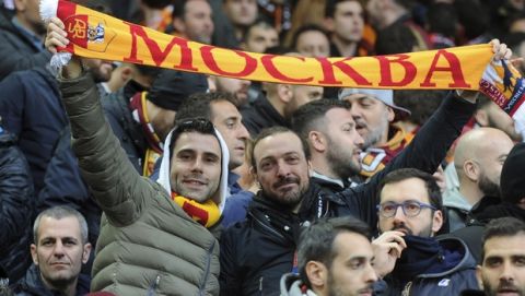 Roma fans hold up scarf that reads: ''Moscow'' and cheer prior to the Champions League semifinal, first leg, soccer match between Liverpool and Roma at Anfield Stadium, Liverpool, England, Tuesday, April 24, 2018. (AP Photo/Rui Vieira)