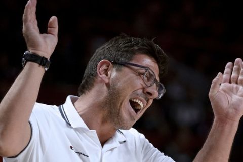 Greece's coach Fotios Katsikaris reacts during the 2014 FIBA World basketball championships round of 16 match Serbia vs Greece at the Palacio de los Deportes in Madrid on September 7, 2014.  AFP PHOTO / DANI POZO