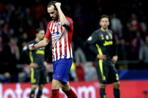 Atletico defender Diego Godin celebrates scoring his side's 2nd goal, during the Champions League round of 16 first leg soccer match between Atletico Madrid and Juventus at Wanda Metropolitano stadium in Madrid, Wednesday, Feb. 20, 2019. (AP Photo/Andrea Comas)
