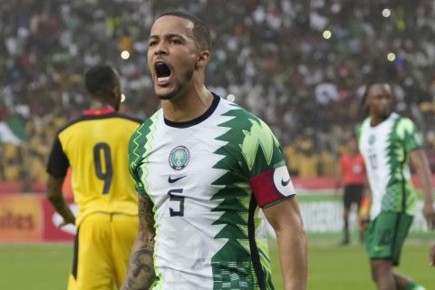 Nigeria's William Troost-Ekong celebrates after he scored a penalty against Ghana during their 2022 Qatar World Cup qualifying playoff second leg at Moshood Abiola Stadium in Abuja, Nigeria, Tuesday, March. 29, 2022. Ghana became the first team from Africa to qualify for the World Cup in Qatar after a 1-1 draw with Nigeria in the second leg of their playoff on Tuesday to advance on away goals. (AP Photo/Sunday Alamba)
