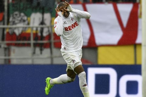Cologne's Anthony Modeste celebrates after he scored his third goal during the German Bundesliga soccer match between 1.FC Cologne and Hertha BSC Berlin in Cologne, Germany, Saturday, March 18, 2017. (AP Photo/Martin Meissner)