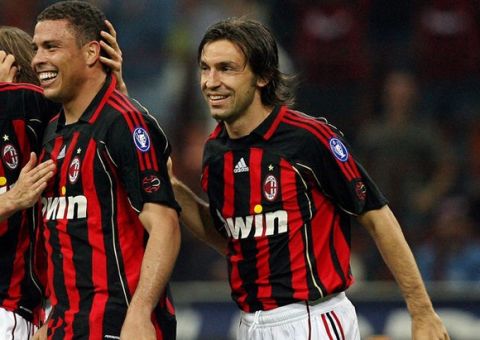 Milan, ITALY: AC Milan's forward Ronaldo (C) is congratulated by his teammate Yoann Gourcuff (L) and Andrea Pirlo after scoring a goal against Cagliari during their Italian serie A football match at San Siro stadium in Milan, 21 April 2007. AFP PHOTO   Paco SERINELLI (Photo credit should read PACO SERINELLI/AFP/Getty Images)