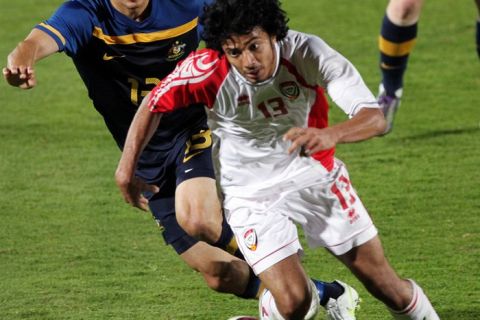 (FILES) --  A picture dated January 5, 2011 shows UAE's Theyab Awana (front) controling the vall during his team's friendly football match against Australia in Al-Ain. Awana, 21, member of the UAE Olympic and national team, died of a tragic car accident in Abu Dhabi on September 25, 2011.  AFP PHOTO/KARIM SAHIB (Photo credit should read KARIM SAHIB/AFP/Getty Images)