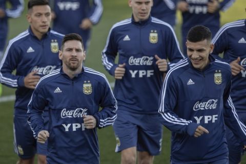 Argentina's national soccer player Lionel Messi, bottom left, during a training session in Madrid, Spain, Monday, March 18, 2019. Argentina will play a friendly soccer match against Venezuela on Friday.(AP Photo/Bernat Armangue)