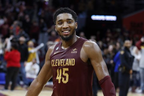 Cleveland Cavaliers guard Donovan Mitchell celebrates a 145-134 overtime win against the Chicago Bulls during the second half of an NBA basketball game, Monday, Jan. 2, 2023, in Cleveland. (AP Photo/Ron Schwane)