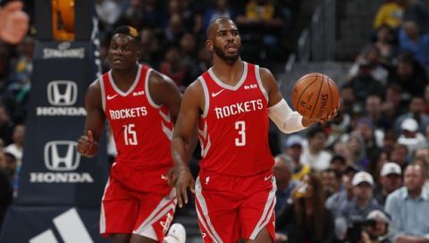 Houston Rockets guard Chris Paul (3) and Houston Rockets center Clint Capela (15) in the first half of an NBA basketball game Tuesday, Nov. 13, 2018, in Denver. (AP Photo/David Zalubowski)