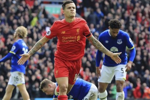 Liverpool's Philippe Coutinho celebrates scoring his side's second goal, during the English Premier League soccer match between Liverpool and Everton, at Anfield, in Liverpool, England, Saturday April 1, 2017. (Peter Byrne/PA via AP)