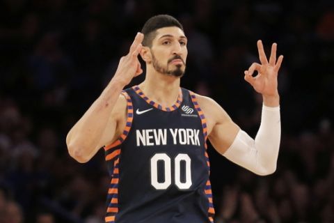New York Knicks' Enes Kanter reacts after scoring during the first half of the NBA basketball game against the Milwaukee Bucks, Tuesday, Dec. 25, 2018, in New York. (AP Photo/Seth Wenig)