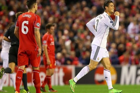 LIVERPOOL, ENGLAND - OCTOBER 22:  Cristiano Ronaldo of Real Madrid celebrates scoring the opening goal during the UEFA Champions League Group B match between Liverpool and Real Madrid CF on October 22, 2014 in Liverpool, United Kingdom.  (Photo by Alex Livesey/Getty Images)