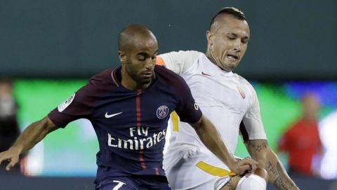 AS Roma's Radja Nainggolan, right, and Paris Saint-Germain's Lucas Moura try to control the ball during the second half of the International Champions Cup soccer match Wednesday, July 19, 2017, in Detroit. (AP Photo/Carlos Osorio)