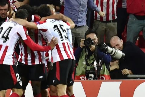 Bilbao's scorer Inaki Williams, 2nd left, and his teammates celebrate their side's 3rd goal during the Europa League Group J soccer match between Athletic Club Bilbao and Hertha BSC Berlin at the Estadio de San Mames in Bilbao, Spain, Thursday, Nov. 23, 2017. (AP Photo/Alvaro Barrientos)