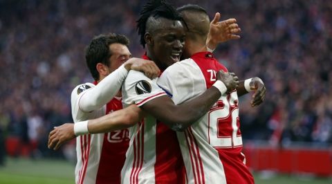 Ajax's Bertrand Traore, center, celebrates with his teammates after scoring the fourth goal of his team during the first leg semi final soccer match between Ajax and Olympique Lyon in the Amsterdam ArenA stadium, Netherlands, Wednesday, May 3, 2017. (AP Photo/Peter Dejong)