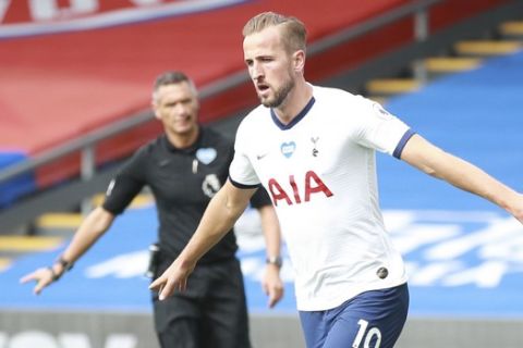 Tottenham's Harry Kane celebrates after scoring his side's opening goal during the English Premier League soccer match between Crystal Palace and Tottenham at the Selhurst Park stadium in London, Sunday, July 26, 2020. (AP Photo/Ian Walton, Pool)