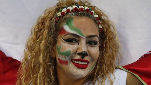 Iranian soccer fan cheers as she waits for the group B match between Iran and Spain at the 2018 soccer World Cup in the Kazan Arena in Kazan, Russia, Wednesday, June 20, 2018. (AP Photo/Frank Augstein)