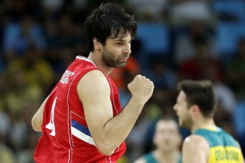 Serbia's Milos Teodosic reacts after making a three-point basket during a semifinal round basketball game against Australia at the 2016 Summer Olympics in Rio de Janeiro, Brazil, Friday, Aug. 19, 2016. (AP Photo/Charlie Neibergall)