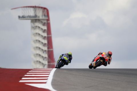 Marc Marquez (93), of Spain, is trailed by Valentino Rossi (46), of Italy, during open practice for the Grand Prix of the Americas MotoGP motorcycle race, Friday, April 21, 2017, in Austin, Texas. (AP Photo/Eric Gay)