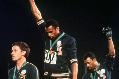 FILe - In this Oct. 16, 1968, file photo, U.S. athletes Tommie Smith, center, and John Carlos stare downward while extending gloved hands skyward during the playing of the Star Spangled Banner after Smith received the gold and Carlos the bronze for the 200 meter run at the Summer Olympic Games in Mexico City. Australian silver medalist Peter Norman is at left. Smith and Carlos, the American sprinters whose raised-fist salutes at the 1968 Olympics are an ageless sign of race-inspired protest, will join the U.S. Olympic team at the White House next week for its meeting with President Barack Obama. Smith and Carlos were sent home from the Olympics after raising their black-gloved fists in a symbolic protest during the U.S. national anthem. They called it a ``human rights salute.''
The USOC asked them to serve as ambassadors as it tries to make its own leadership more diverse. (AP Photo/File)
