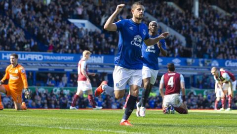 Everton's Kevin Mirallas, center right, celebrates after scoring past Burnley's goalkeeper Thomas Heaton, left, during the English Premier League soccer match between Everton and Burnley at Goodison Park Stadium, Liverpool, England, Saturday April 18, 2015. (AP Photo/Jon Super)  
