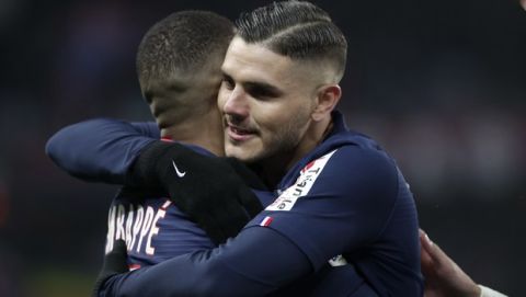 PSG's Mauro Icardi, right, celebrates his side third goal with Kylian Mbappe during the French League Cup quarter final soccer match between Paris Saint Germain and Saint Etienne at the Parc des Princes stadium in Paris, Wednesday, Jan. 8, 2020. (AP Photo/Thibault Camus)
