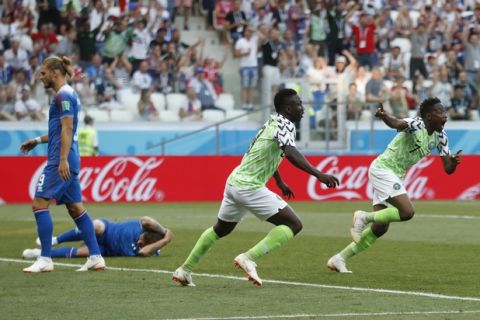 Nigeria's Ahmed Musa, right, celebrates after scoring his team's first goal during the group D match between Nigeria and Iceland at the 2018 soccer World Cup in the Volgograd Arena in Volgograd, Russia, Friday, June 22, 2018. (AP Photo/Darko Vojinovic)