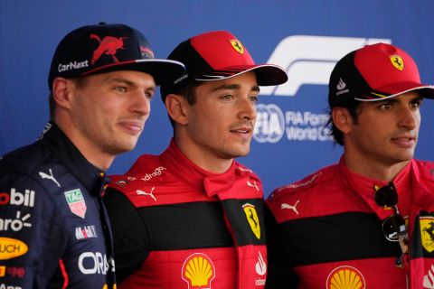 Ferrari driver Charles Leclerc of Monaco, center, pole position, is flanked by second fastest time Red Bull driver Max Verstappen of the Netherlands, left, and third fastest time Ferrari driver Carlos Sainz of Spain, pose for photographers after the qualifying session at the Barcelona Catalunya racetrack in Montmelo, Spain, Saturday, May 21, 2022. The Formula One race will be held on Sunday. (AP Photo/Manu Fernandez)