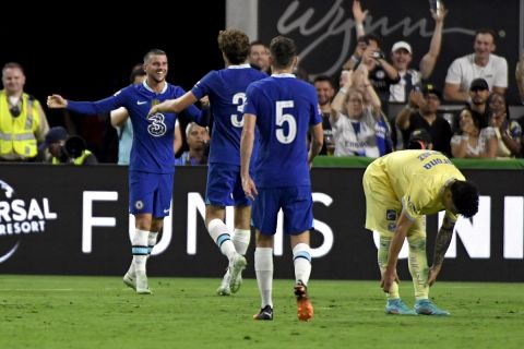 Chelsea midfielder Mason Mount, left, celebrates with teammates team after scoring against Club América during the second half of a friendly soccer match Saturday, July 16, 2022, in Las Vegas. (AP Photo/David Becker)