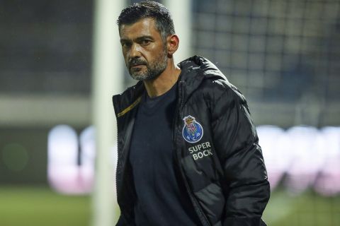Porto's head coach Sergio Conceicao walks on the touchline during the Portuguese League soccer match between FC Famalicao and FC Porto in Famalicao, Portugal, Wednesday, June 3, 2020. The Portuguese League soccer matches resumed Wednesday without spectators because of the coronavirus pandemic. (Jose Coelho/Pool via AP)