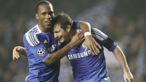 Chelsea's Frank Lampard, right, and Didier Drogba celebrates their win through to the next round against Napoli at the end of their Champions League last sixteen second leg soccer match at Stamford Bridge, London, Wednesday, March 14, 2012.  (AP Photo/Kirsty Wigglesworth)