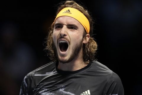 Stefanos Tsitsipas of Greece celebrates at match point after winning against Daniil Medvedev of Russia during their ATP World Tour Finals singles tennis match at the O2 Arena in London, Monday, Nov. 11, 2019. (AP Photo/Kirsty Wigglesworth)