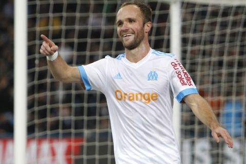 Marseille's Valere Germain celebrates after scoring his second goal during the League One soccer match between Marseille and Saint-Etienne, at the Velodrome stadium, in Marseille, southern France, Sunday, Dec. 10, 2017. (AP Photo/Claude Paris)