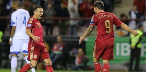 Spain's forward Paco Alcacer  (R) celebrates with Spain's midfielder Santi Cazorla during the Euro 2016 qualifying football match Spain vs Luxembourg at Las Gaunas stadium in Logrono on October 9, 2015. AFP PHOTO/ CESAR MANSO        (Photo credit should read CESAR MANSO/AFP/Getty Images)